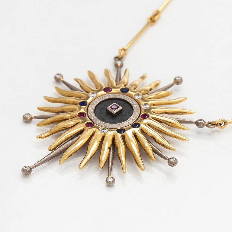Pendant, faceted sapphires, rubies and diamonds, iron ore, 18K gold and white gold.