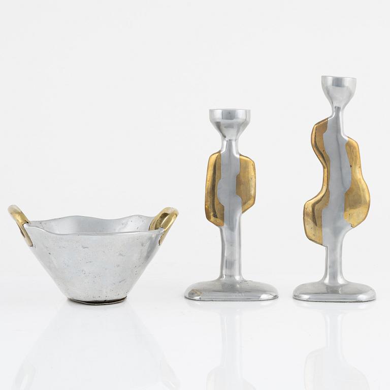David Marshall, a metall and brass bowl and a pair of candle sticks.
