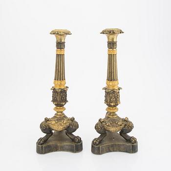A pair of late Empire candle sticks.
