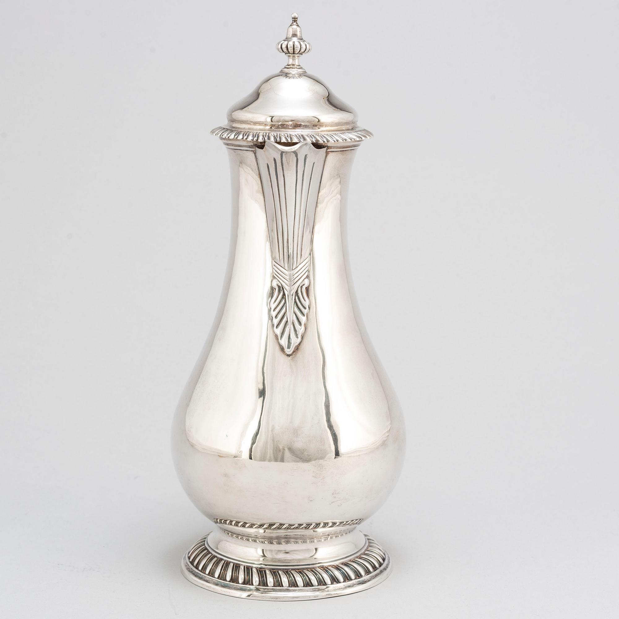 An English 18th century silver wine jug, mark of Augustin Le Sage, London 1770.