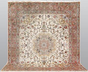 A Tabriz part silk carpet, 297 x 253 cm.