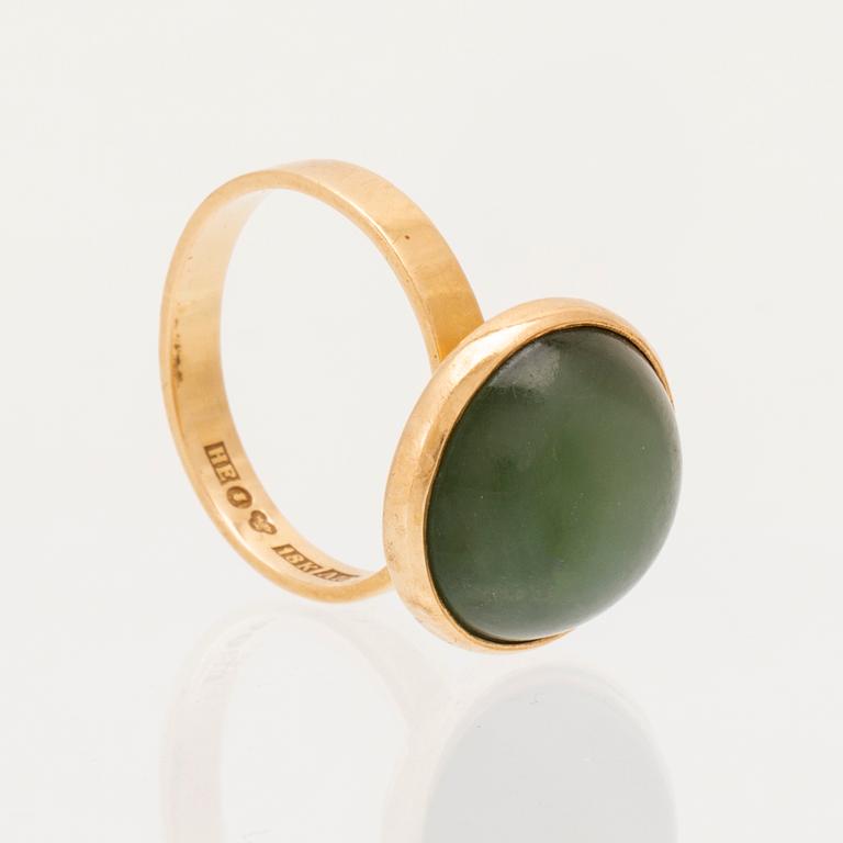 Ateljé Stigbert, an 18K gold ring set with a cabochon cut green stone probably nephrite, 1975.