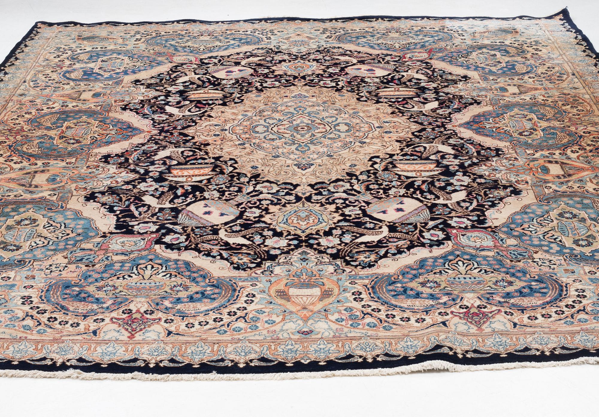 An oriental carpet, circa 390 x 302 cm.