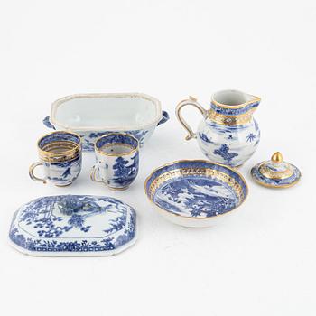 A small Chinese export tureen with cover, two cups, a saucer and a jug with cover, Qing dynasty, 18th century.