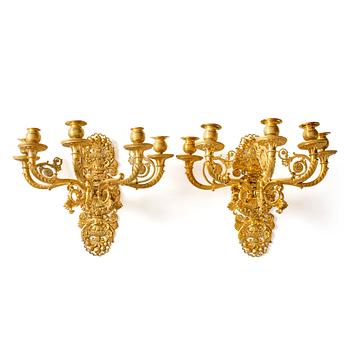 A pair of French Empire ormolu five-branch wall-lights, Paris, early 19th century.