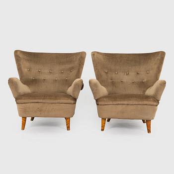 A pair of mid-20th century armchairs.