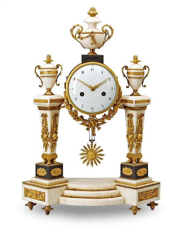 A Louis XVI late 18th century gilt bronze and marble mantel clock.