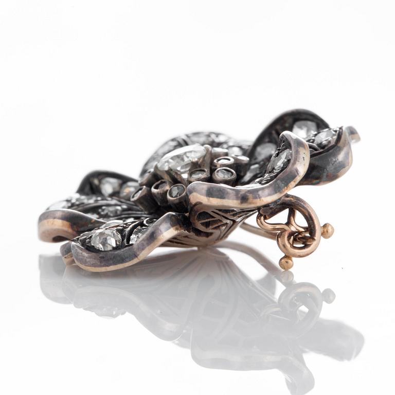 A flower brooch set with old-, eight- and rose-cut diamonds.