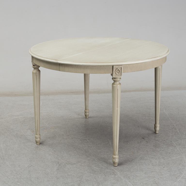 A dining table and six chairs, Gustavian style, second half of the 20th century. One leaf included.