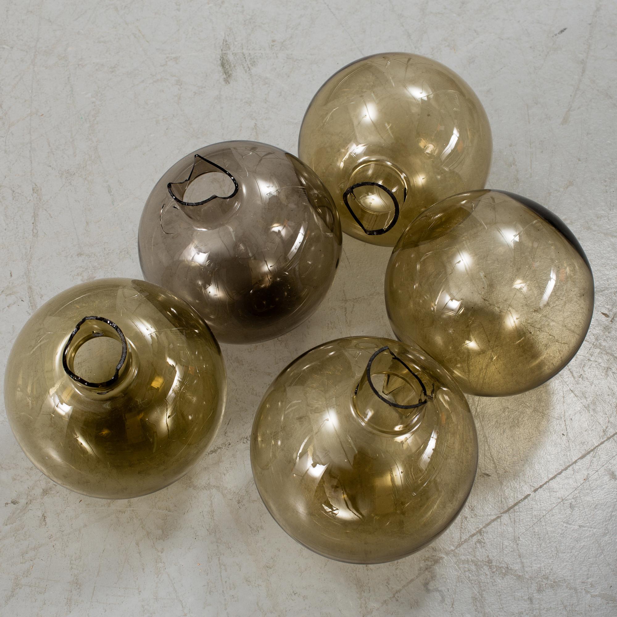 A 20th century brass and smoked glass chandelier by Hans Agne Jakobsson, Markaryd, Sweden.