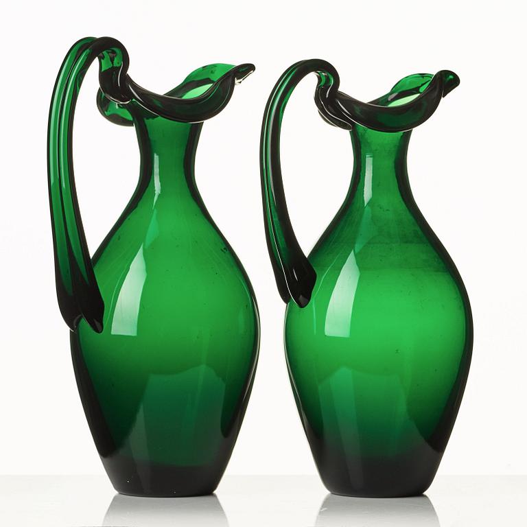 Edward Hald, two emerald green claret jugs, Sandvik's glassworks, Sweden ca 1929, model HS 1021.