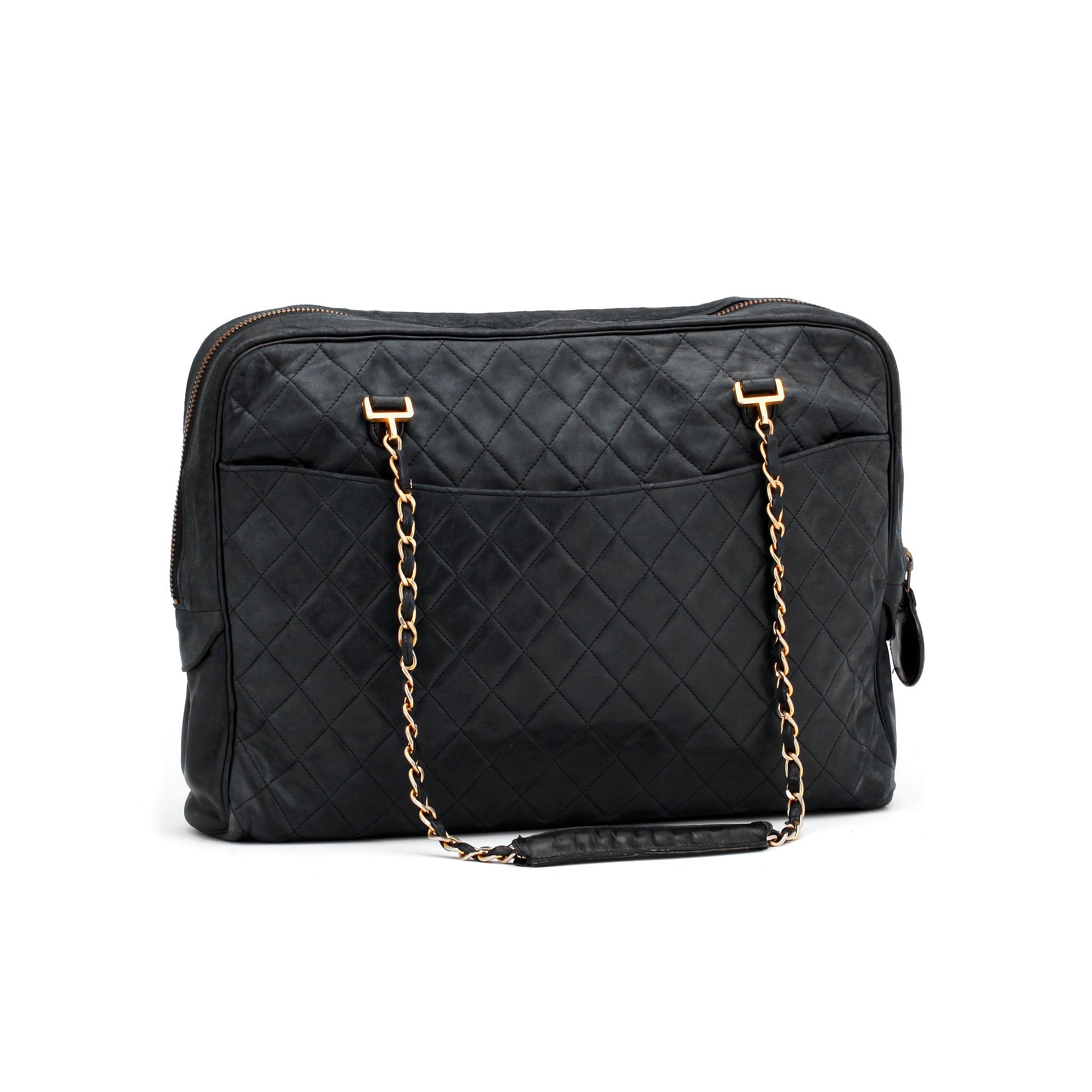 CHANEL, a darkblue leather shoulder bag, 1980s.