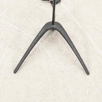 A metal floor lamp from the later part of the 20th century.