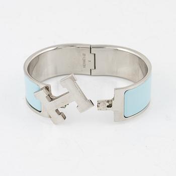 Hermès, a 'Clic Clac H' bracelet.