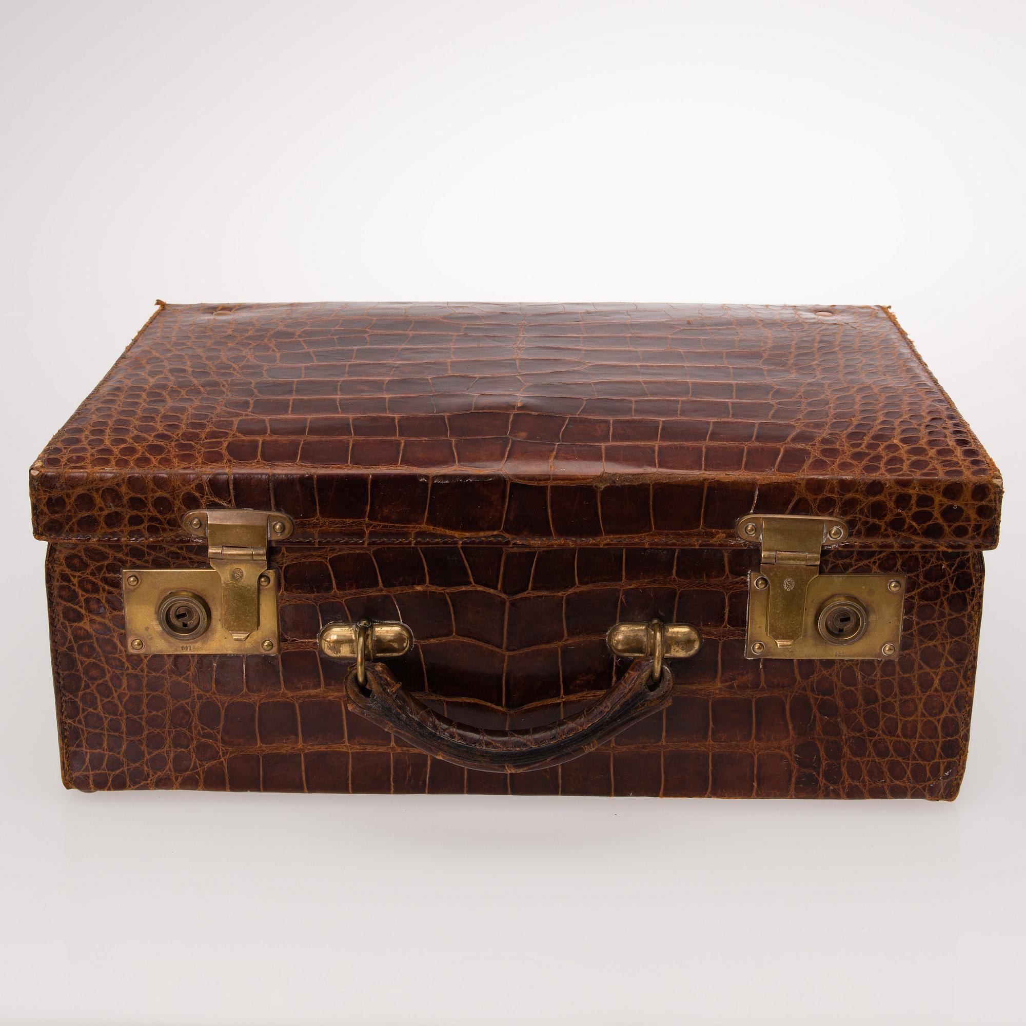 A TRAVEL TOILET CASE, leather, German 1910-20s, boxes with silver lid.