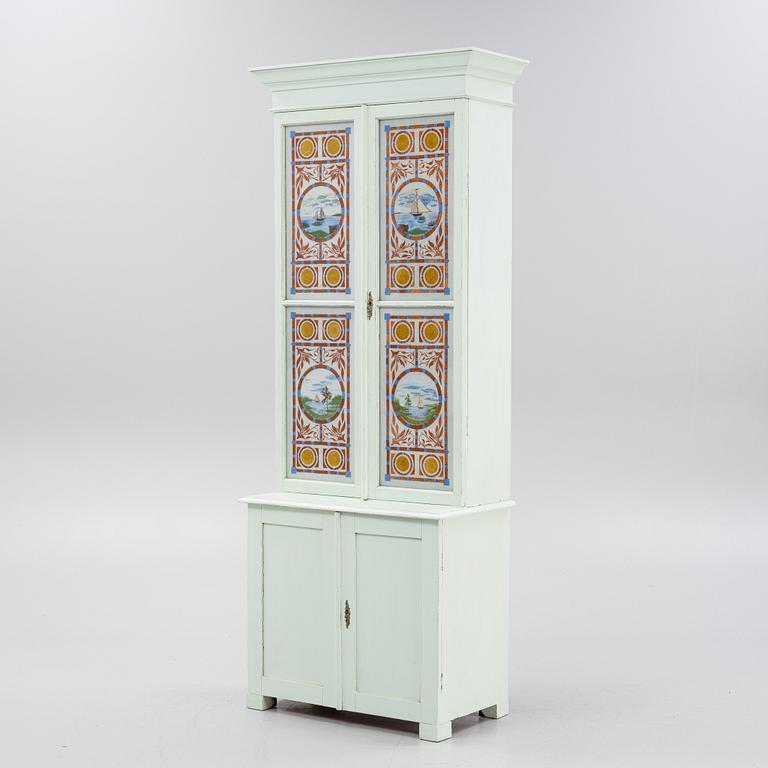 A painted cabinet, circa 1900.