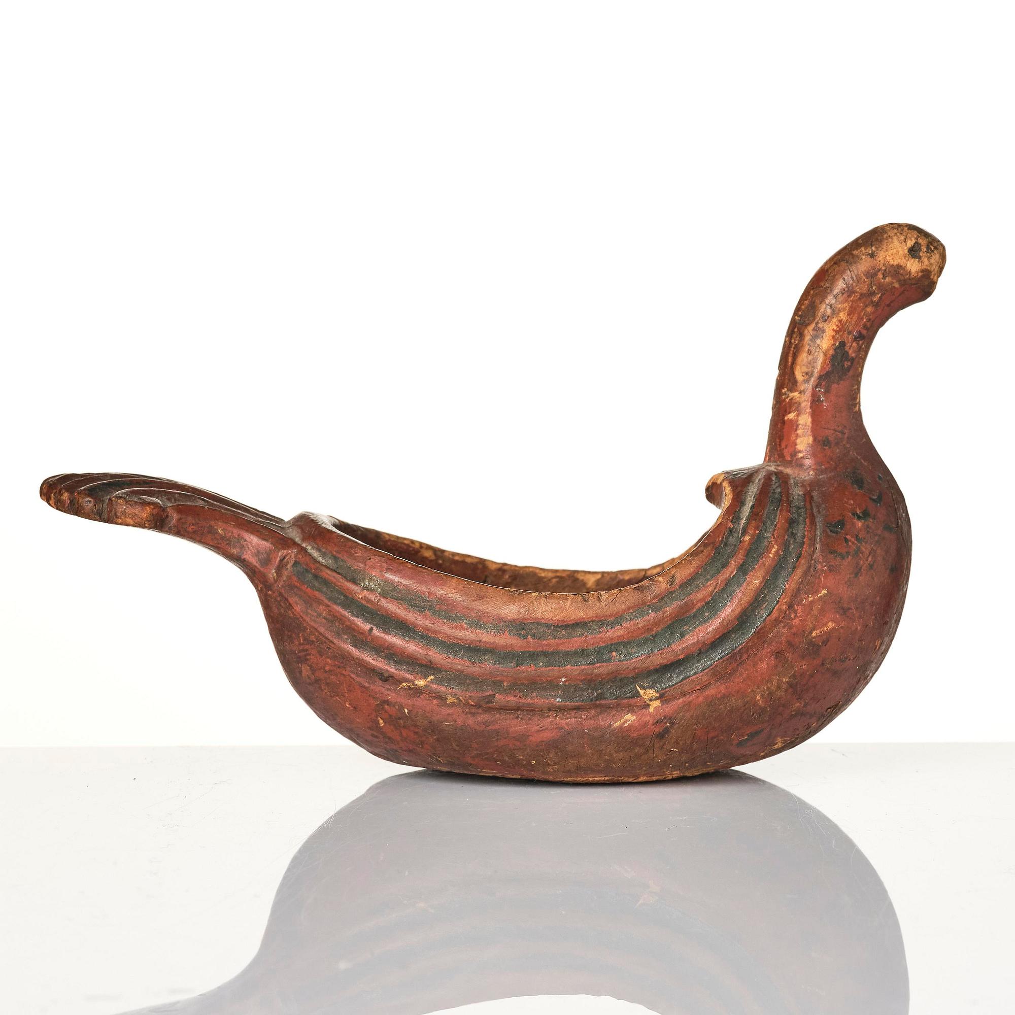 A Swedish carved and painted figural drinking vessel from Jämtland or Härjedalen, late 18th / early 19th century.