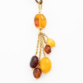 Necklace leather strap and 18K gold with amber.