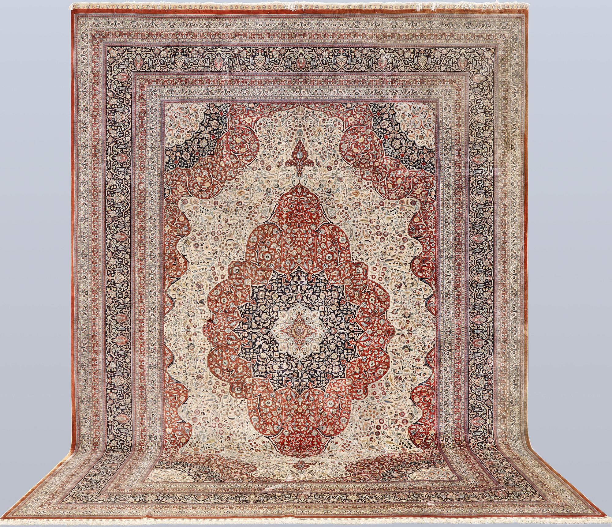 An Oriental silk carpet, c. 436 x 306 cm.