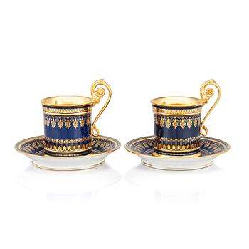 345. A pair of Sèvres cups with stands, 19th Century.