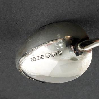 22 swedish silver spoons and one ladle, from the 19th and 20th century.