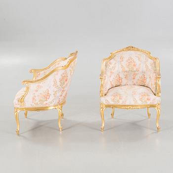 A pair of rococo style bergères, late 19th century.