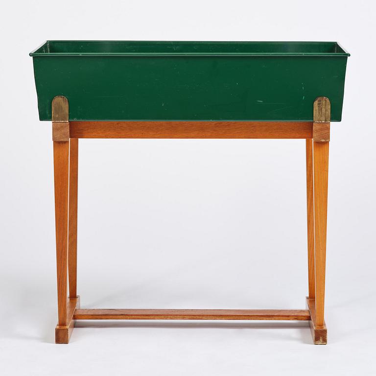 Josef Frank, a rare flower table with green lacquered box model B 2084, Firma Svenskt Tenn, 1950-60s.