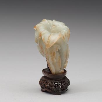 A celadon nephrite floral group, Qing dynasty (1644-1944).