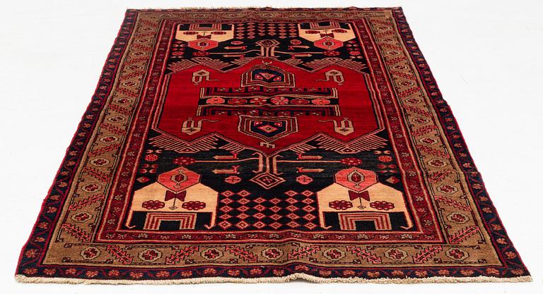 A west persian rug, ca 244 x 141 cm.