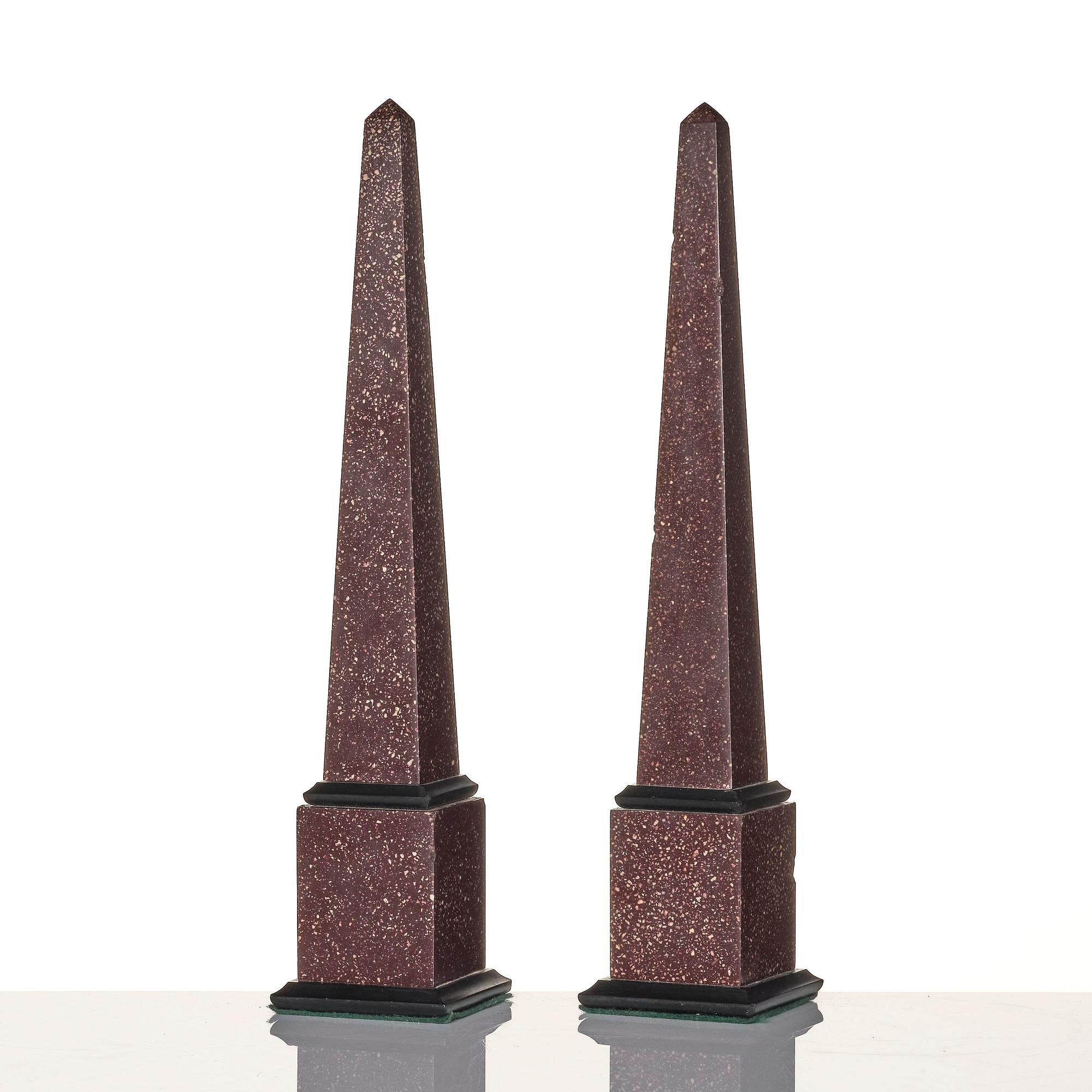 A pair of Egyptian porphyry obelisks 20 th century.