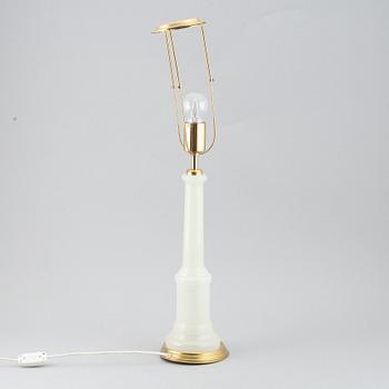 A brass and glass table lamp with lamp-shade. Svenskt Tenn, model no. 2583.