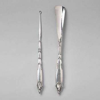 124. Georg Jensen, a shoehorn and a tool for tying shoe laces, Copenhagen ca 1918-20, 830/ 1000 silver.