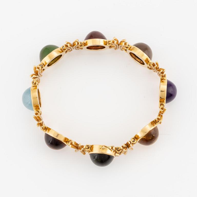W.A. Bolin, design Barbro Littmarck, armband, 18K guld med cabochonslipade färgstenar, Stockholm 1970.