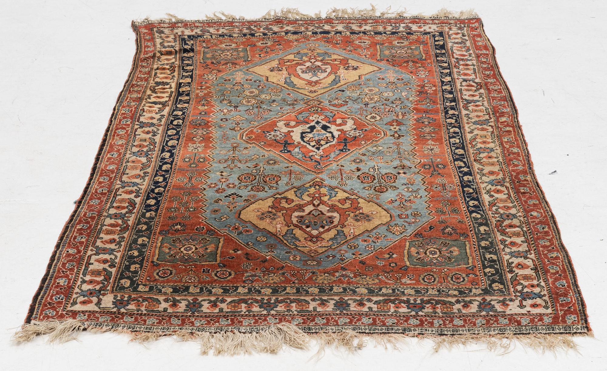 An antique Qashqai rug, southeastern Iran, c 204 x 102 cm.