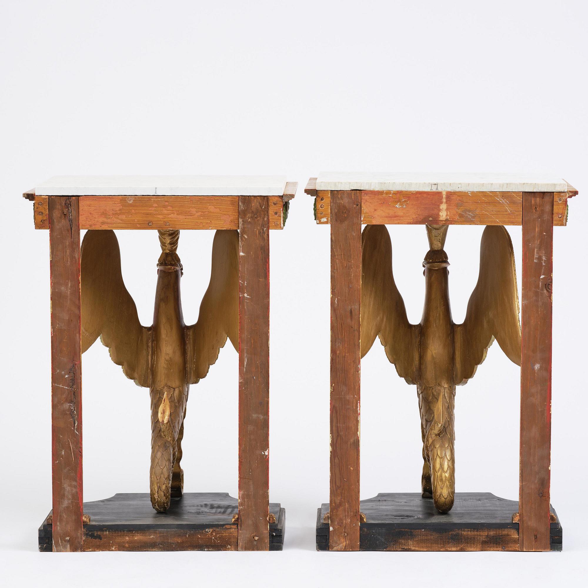 A pair of giltwood console tables, Empire-style incorporating older elements.