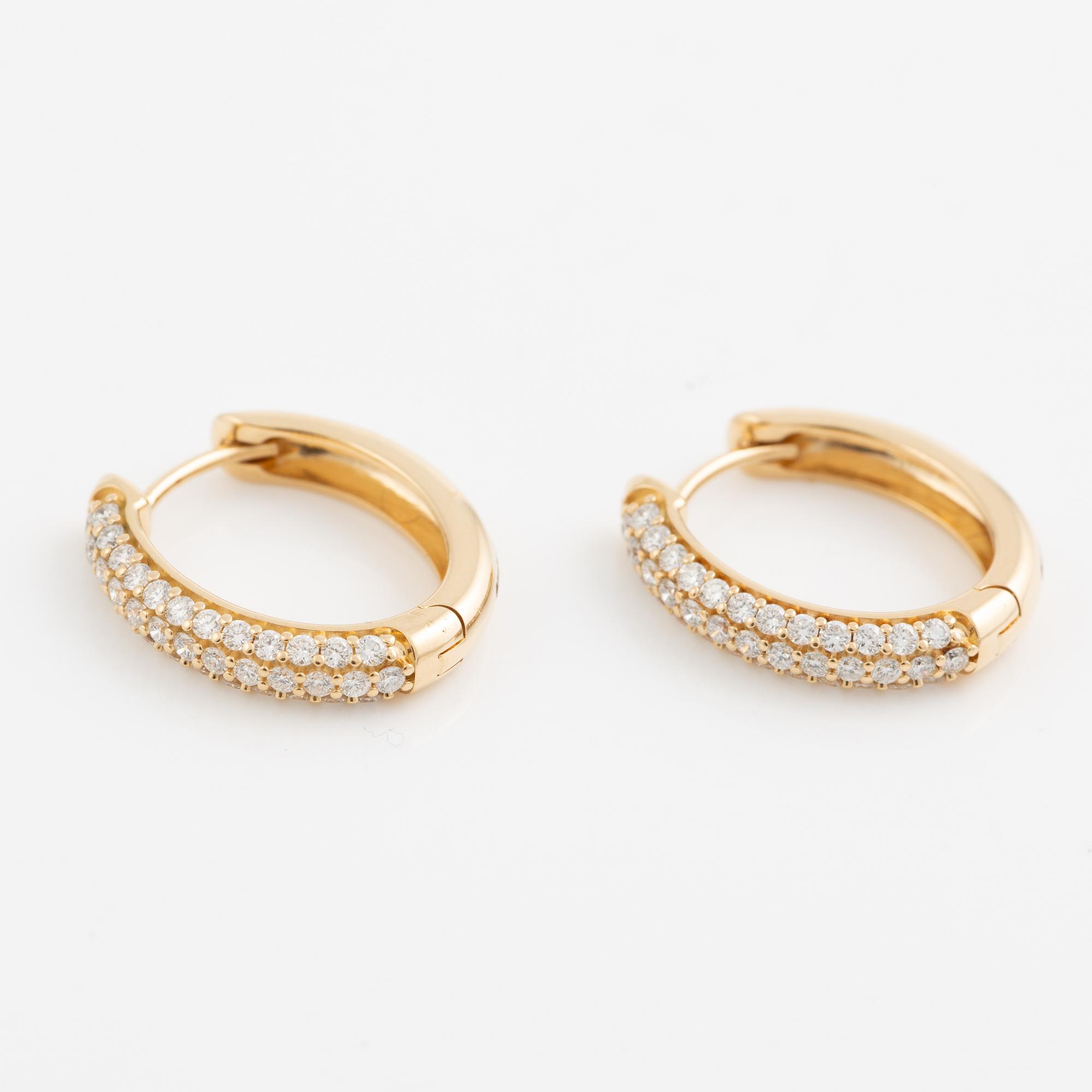 Hoop earrings in 18K gold set with brilliant-cut diamonds.