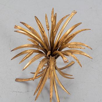 A HANS KÖGL ROUND GLAS AND GUILT METAL SMALL COFFEE TABLE.