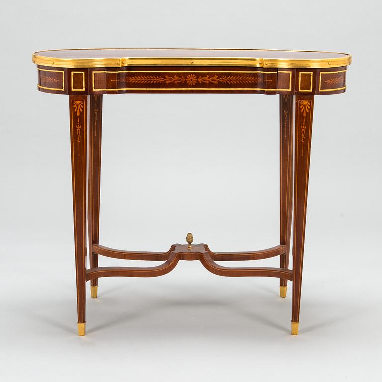 A Directoire style marquetry table from around year 1900.