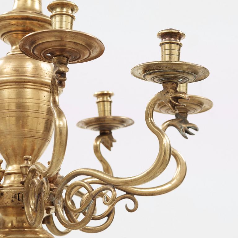 A 19th century eight-light brass chandelier in the manner of Hans Rogiers van Harelbeke.