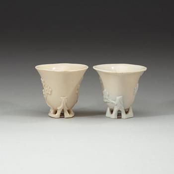 A pair of blanc de chine libation cups, Qing dynasty 18th century.