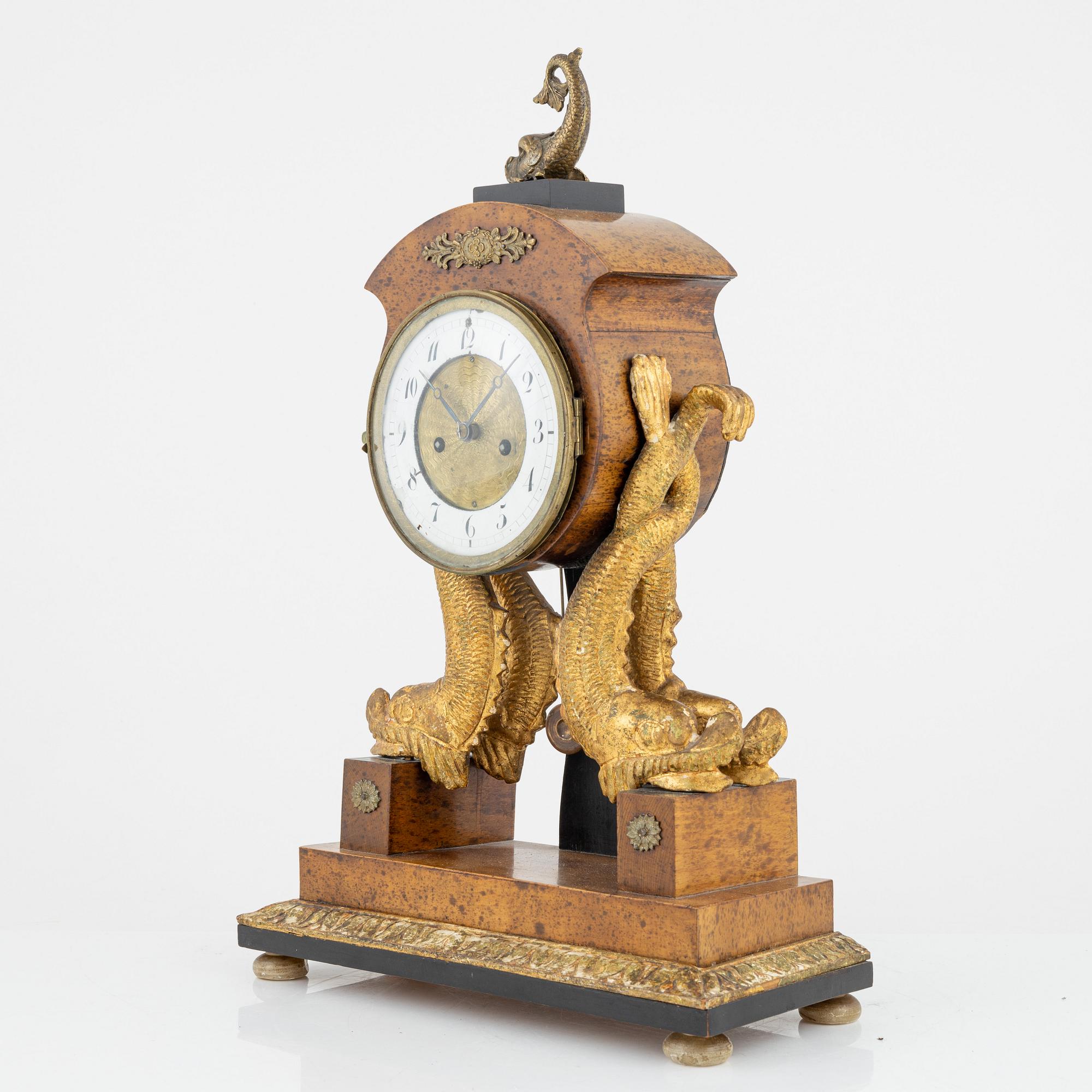 An Empire mantle clock, 19th Century.