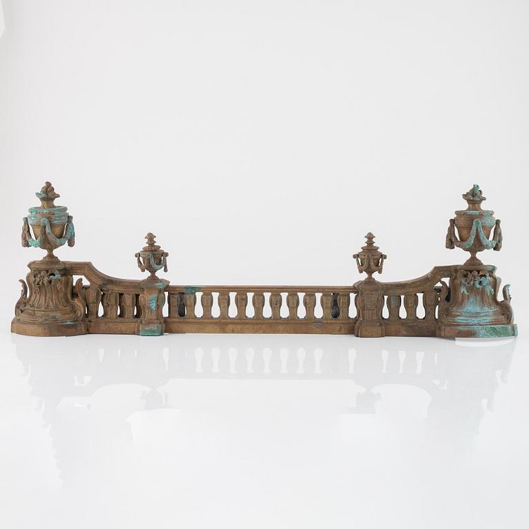 A Louis XVI style bronze grate, 19th Century.
