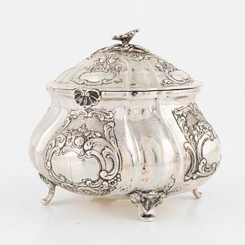 A silver rococo style sugarbox, early 20th Century.