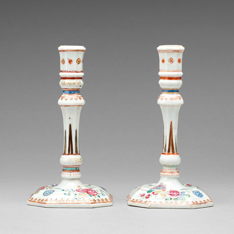 A pair of famille rose candle sticks, Qing dynasty, Qianlong (1736-95).