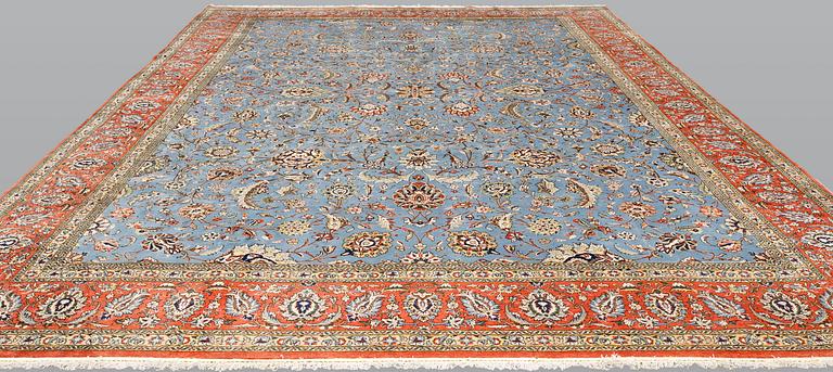 A Ghom carpet, part silk, approx. 480 x 350 cm.