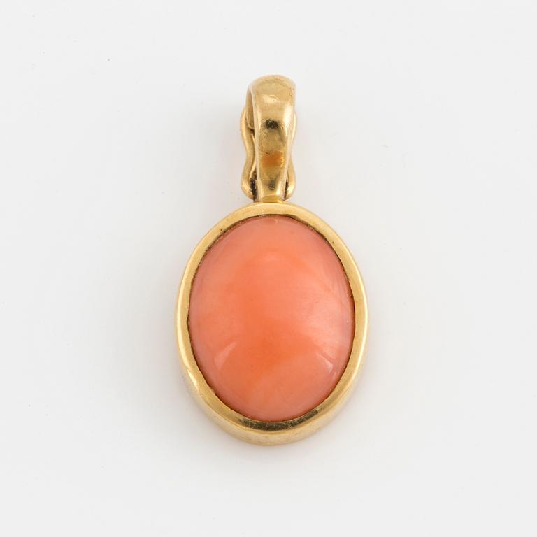 An Ole Lyngaard 18K gold and coral pendant.