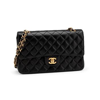 586. CHANEL, a quilted black leather "Double Flap" shoulder bag.