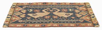 A carriage cushion, flat weave, c 87 x 58 cm, Skåne, circa 1900.