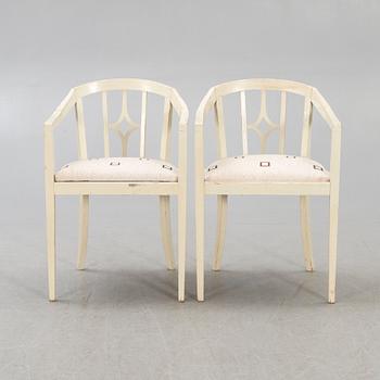 A pair of early 1900s armchairs.