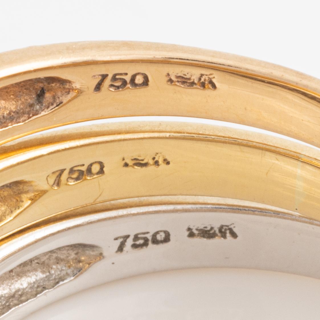 Tre ringar 18K guld med runda briljantslipade diamanter.